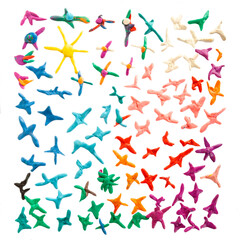 Beautiful sky made from plasticine -clay, sun and colorful stars placed on white background.Children's work of colorful clay as background.