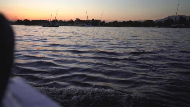 colourful sunset on the Nilo river in Egypt while cruising on sail boat 
