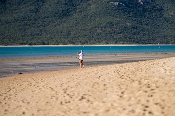 walking on a beautiful sandy beach in queensland australia