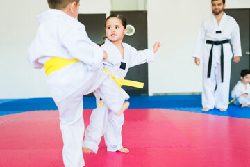 Kids training during a karate class © AntonioDiaz