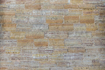 Gray and orange textured brick wall background for stone tiles. Modern interior and exterior design, as well as a background drawing for the designer.