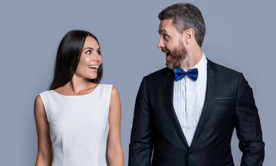 surprised couple in formal tuxedo. studio shot of formal tuxedo couple. elegant couple