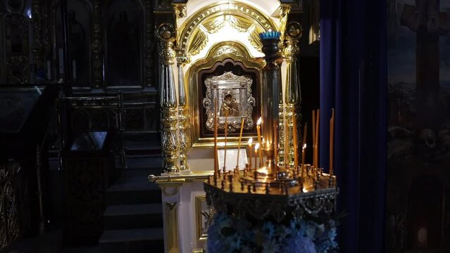 candles in the Orthodox church in front of the icon of the Feodorovskaya Mother of God