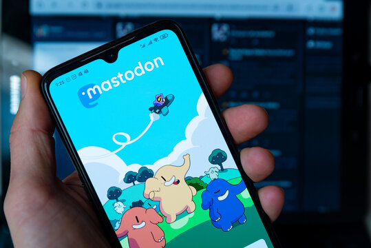 Barcelona, Spain - 07 November 2022: The Mastodon homepage is seen on the display of a mobile phone held by a hand.