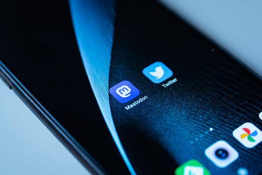 Barcelona, Spain - 07 November 2022: The Mastodon and Twitter apps logos are seen on the display of a mobile phone. It has reported that more than 200.000 new users flocked the social media app
