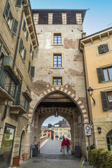 Fototapeta na wymiar The arch and the tower of Ponte Pietra in Verona