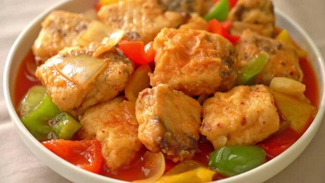 fish stew with tomato and pepper on plate