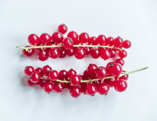 Group of red and wet currants on a white background