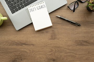 Notebook with 2023 goals text on it to apply new year resolutions and plan.