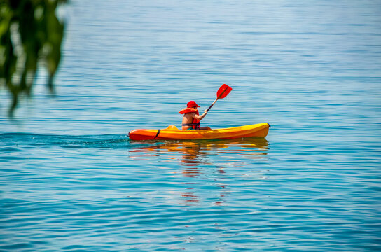 First kayaking lessons on the calm sea.during Summer vacations in Greece