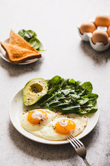 Healthy Breakfast with Wholemeal Bread Toast, Eggs with Green Salad, Avocado. traditional breakfast