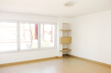 The design of the apartment with white walls, yellow floor and transparent large windows