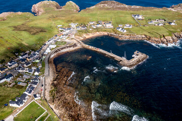 Aerial view of the settlement An Baile Thiar or West Town on Tory Island and harbour, County Donegal, Republic of Ireland © Lukassek