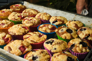 freshly baked muffins with berries