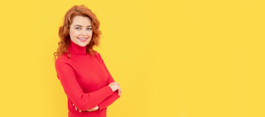beautiful redhead girl face portrait smiling on yellow background, copy space, fashion