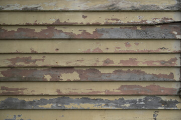 Old weathered painted horizontal wood cladding , weathered painted wood, shabby chic weather boards, rustic weathered painted wood panels, background texture
