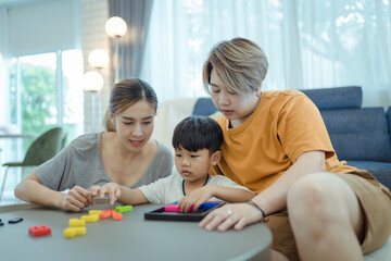 Happy lesbian multiethnic couple in love with childen at home. Family lgbt child happiness concept ,LGBT lesbian couple Moments happiness concept