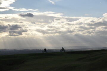 the rolling hills of Burton Dassett with the remains of an old windmill standing as a beacon on the summit