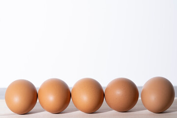 Five eggs standing side by side