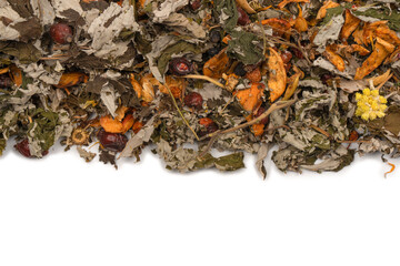 Dry tea leaves and dry fruit isolated on white background.