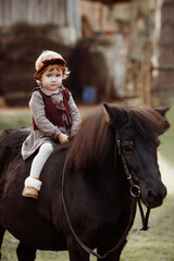 A girl rides a horse