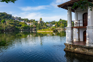 Naklejka premium Island with Palms. Kandy Lake Promenade in Kandy city, Sri Lanka.