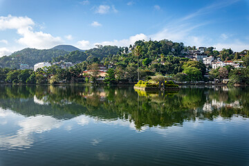 Island with Palms. Kandy Lake Promenade in Kandy city, Sri Lanka.