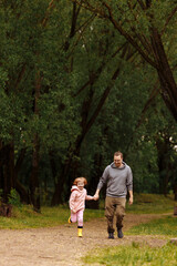 Father and daughter walking