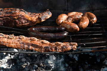 Barbecue, grilled sausages and cow meat , traditional argentine cuisine