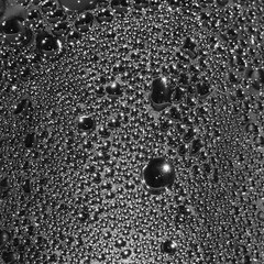 Natural dark silvery black water dew drops texture macro background, vertical textured wet vapour bubble splashes pattern copy space, silver glossy drop detail, large detailed droplet closeup