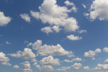 clouds in the sky lit by the sun on a summer day. background