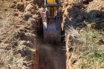 Excavator Digging a Trench for Foundation - 544363955