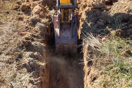 Excavator Digging a Trench for Foundation
