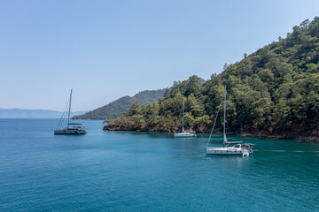 Turquoise sea and aerial view of boats at Ekincik bay. 