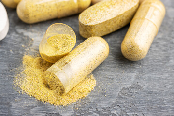 Mix of herbal supplement capsules and vitamin pills