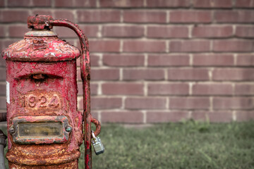 Anique painted and cracked pump in that has 1924 embossed on it.