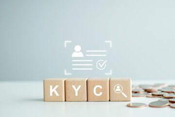 KYC on wooden cubes. know your customer with magnifying glass and customer information. Business verifying the identity of its clients concept. - obrazy, fototapety, plakaty