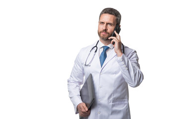 Fototapeta premium Serious doctor talking on mobile phone. Mobile physician holding laptop. Ehealth. Telemedicine