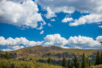 Fototapeta premium blue sky with clouds over mountain range