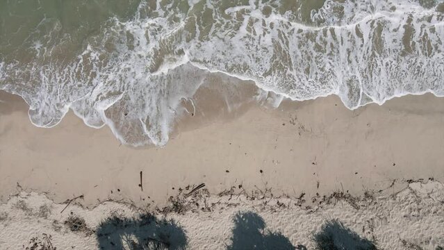 BANTEN, INDONESIA - SEPTEMBER 20th, 2022 : A view of the Sawarna beach tourist attraction located in West Java, Indonesia. The video was taken using a drone.
