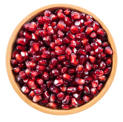 Pomegranate seeds in wooden bowl top view isolated on transparent background with PNG.