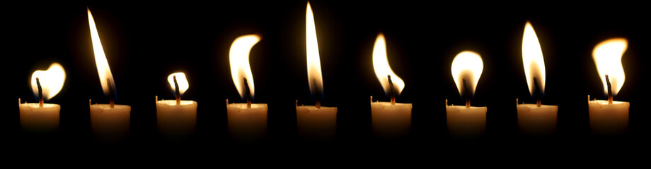 Set The candle flame glows in the dark dark night as background decoration in religious ceremonies and birthday celebrations. Many people have a happy big romantic holiday.