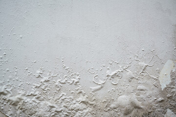 Problem of moisture damage acrylic white painting crack surface texture on exterior dirty stain concrete structure wall background by humidity.home repair old construction concept,renovation house.