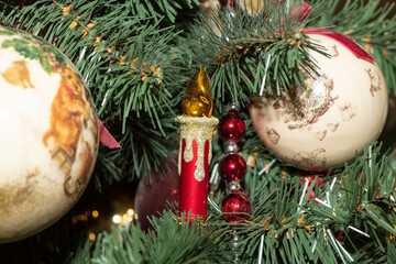 Multi-colored Christmas balls, garlands and toys on the New Year and Christmas tree. Сlose up