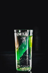 gin tonic cocktail glass on black background 