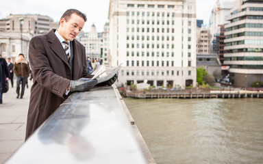London Professionals, City Gent. A smartly dressed business man catching up with the latest...