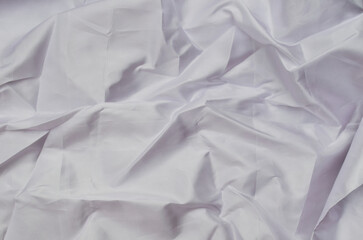 smooth texture of white satin fabric surface. crumpled cloth background.  crumpled background