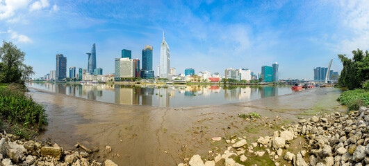 Fototapeta premium Panoramic photo of Ho Chi Minh City seen from the banks of the Saigon River, Vietnam.