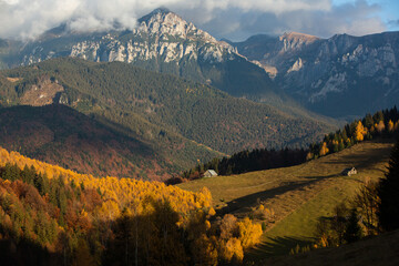 A charming mountain landscape in the Bucegi mountains, Carpathians, Romania. Autumn nature in Moeciu de Sus, Transylvania