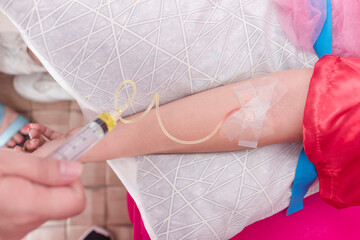 A female customer gets a Glutathione IV infusion therapy session at an aesthetic clinic. Also known...